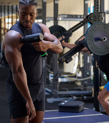 Athlete using Hypervolt 3 Pro on his shoulder in the gym